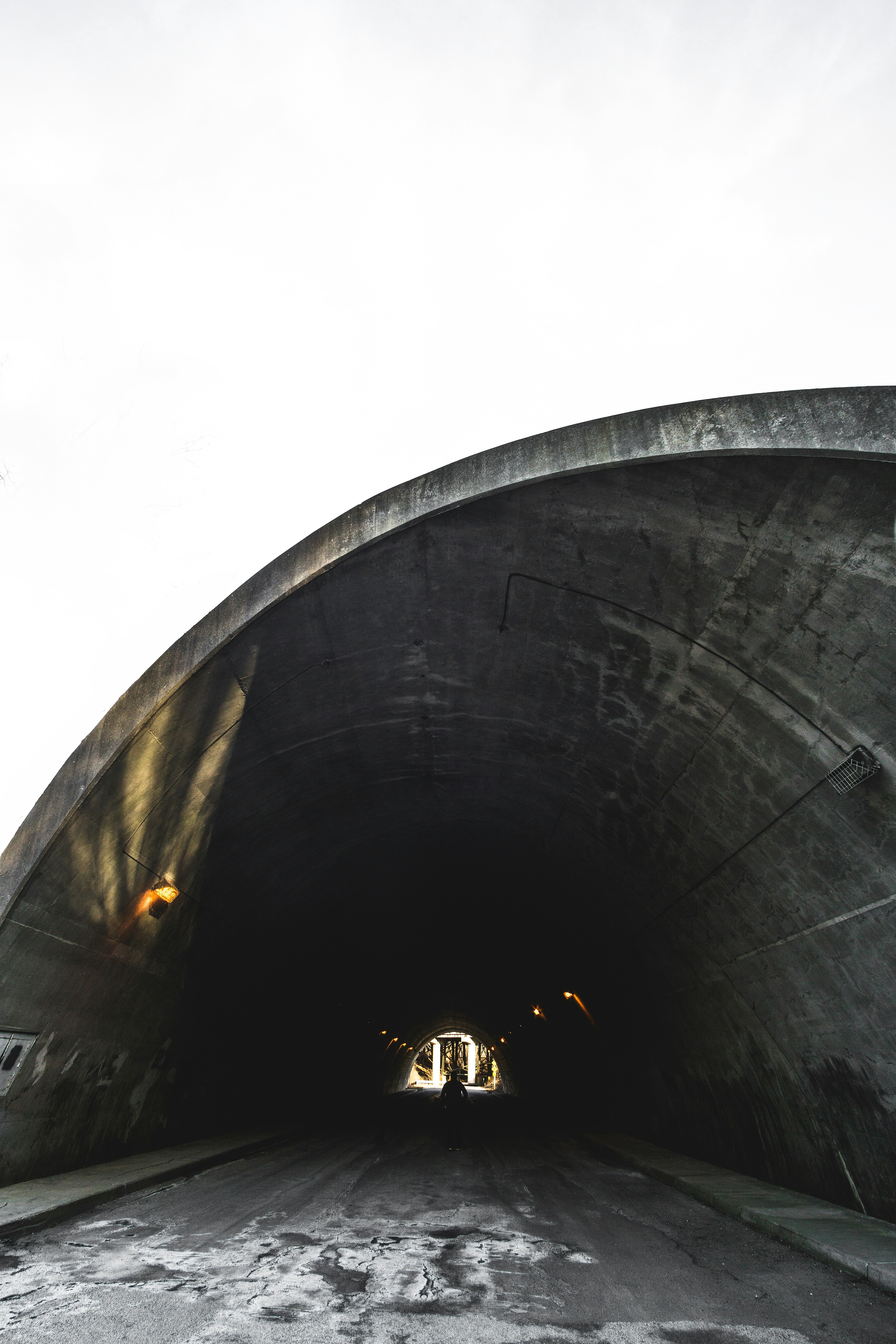 empty tunnel with lights at daytime